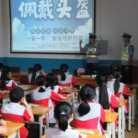 县交警大队组织人员到官湖小学开展安全生产月宣传教育活动