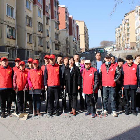 “双报到进社区”开展“清洁家园”学雷锋志愿服务活动