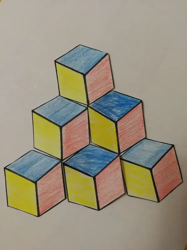 六边形剪下来,按照图示,拼出一个立体图形再自己创意一个大写的z字