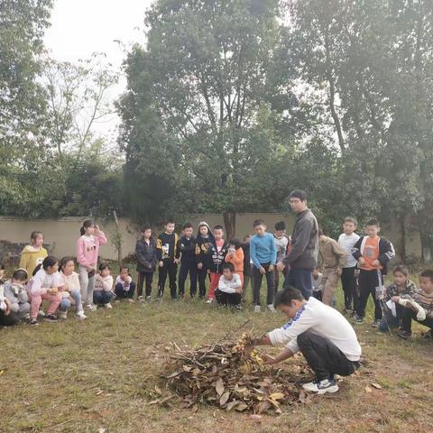 书发希望小学手把手教学生使用灭火器