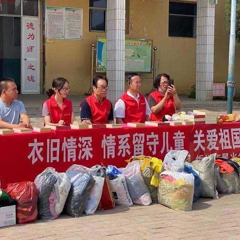 爱心捐赠暖人心----星火公益协会在九原街学区上社小学进行关爱留守儿童活动