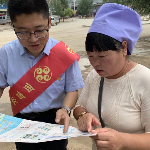 西吉农商行沙沟支行“人民币知识宣传进社区”活动