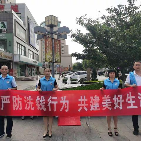 新华保险威海中支前往石岛渔人码头开展社区反洗钱宣传