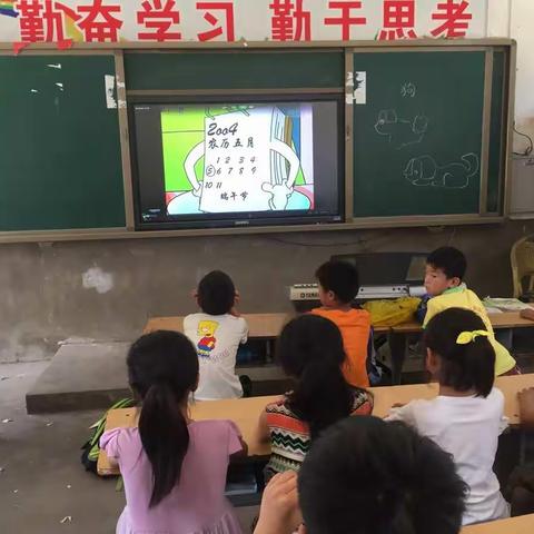 新店镇齐罗小学全体学生共传端午习俗，承民族精神。