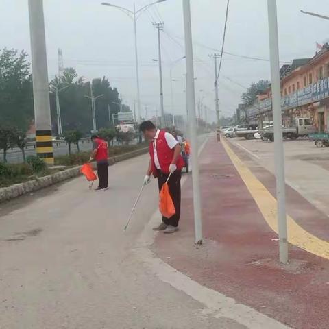 都司镇机关党员干部齐行动，助力创城