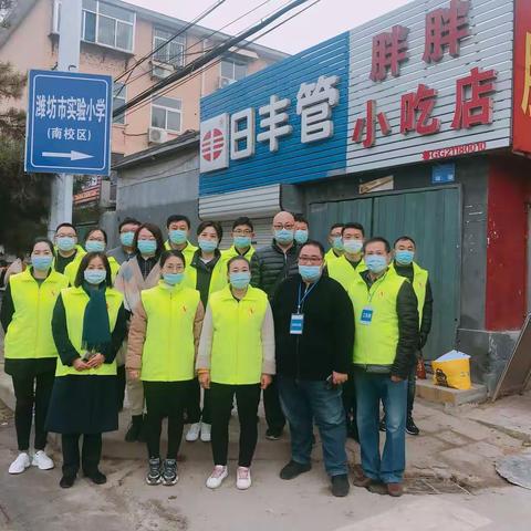 雨中护航 暖心守护——记潍坊实验小学二.六班爱心护卫执勤