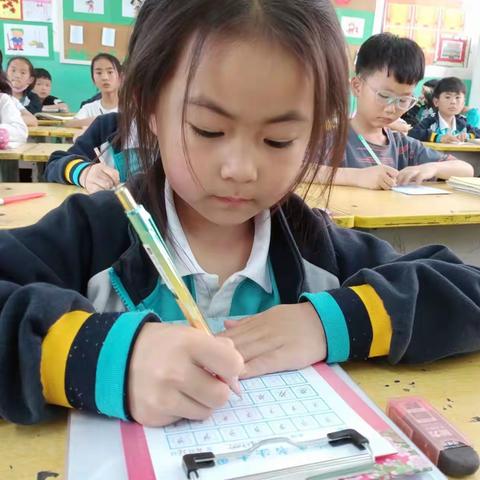 墨韵书香话端午  一笔一画见真功---新城小学书法评比活动