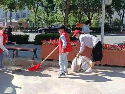 精河镇复兴社区开展辖区市场街环境整治志愿服务活动