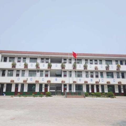 齐心协力迎国检    ——桑梓镇金星完全小学全体教师