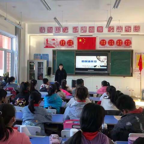 爱旗护旗，我们在行动——卧牛河镇明德小学学习《国旗法》活动简讯