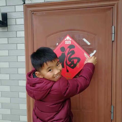 浓墨写新春，春联送祝福——南山学校四（2）中队迎新年实践活动