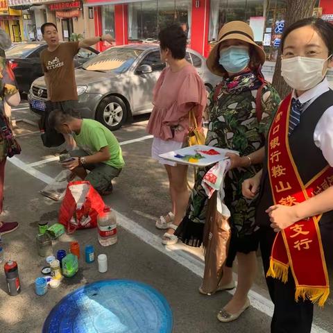 普及金融常识，弘扬金融正能量，铁西支行开展反假货币进社区宣传活动